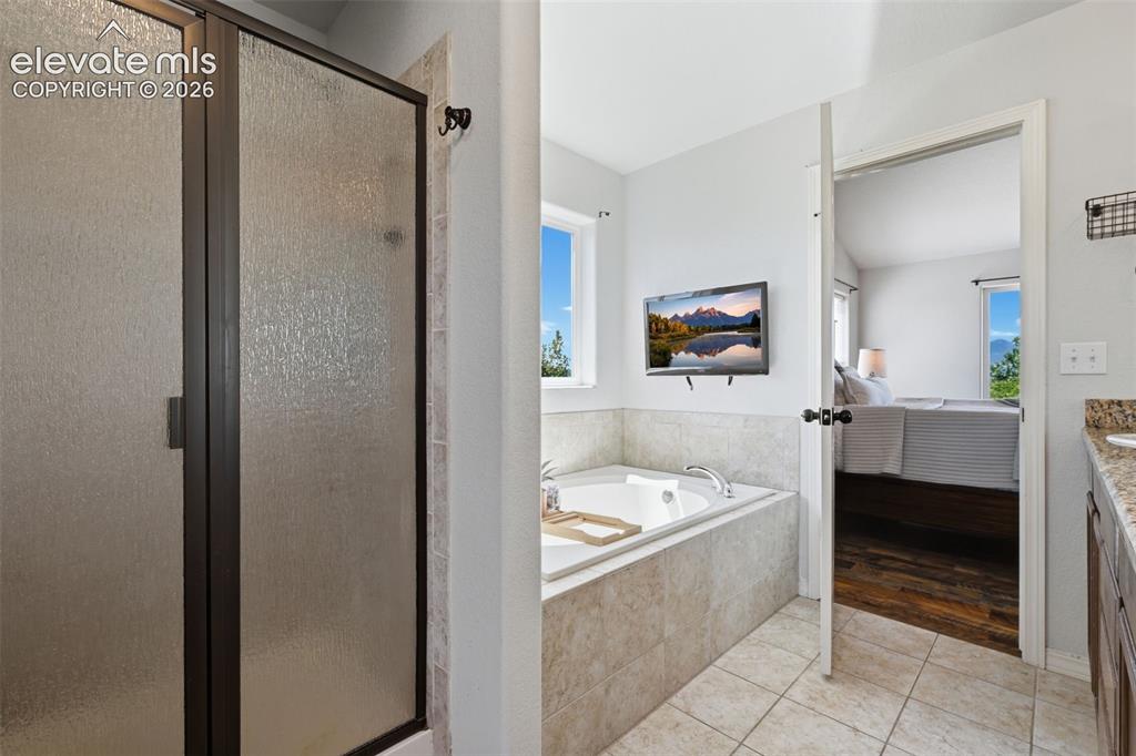 Image 32 of 49: Spa like master bath with included TV!
