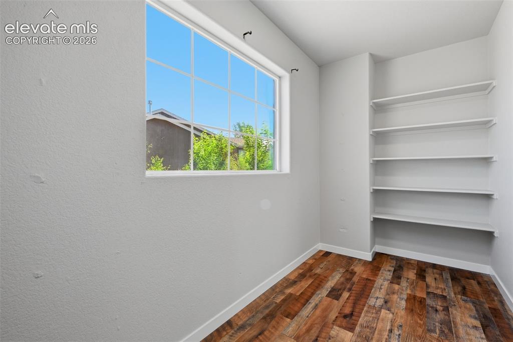 Image 33 of 49: Walk in closet in master with window!