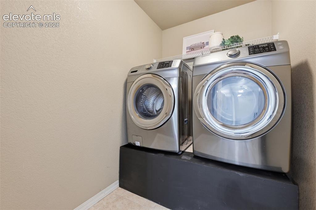 Image 38 of 49: Upstairs laundry for easy living!