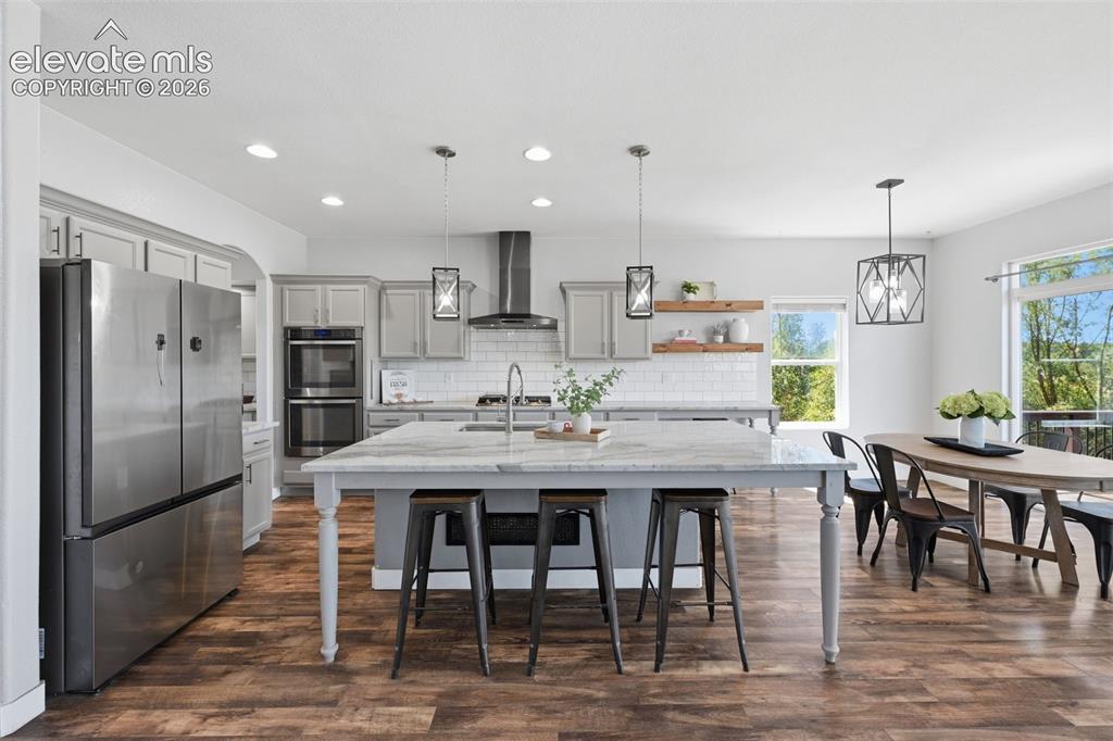 Image 4 of 49: Wonderful kitchen with new fridge, upgraded appliances and lighting!