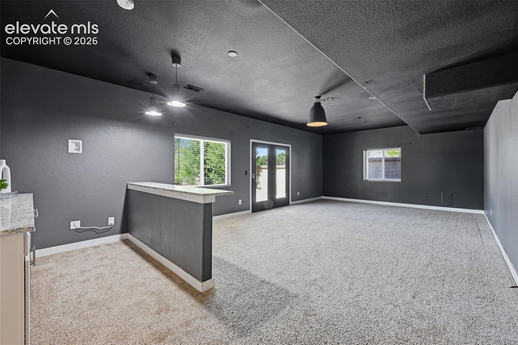 Image 41 of 49: Walk out basement to your private back yard!