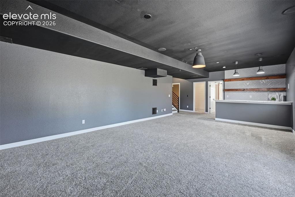 Image 42 of 49: Basement is set up for a movie room!