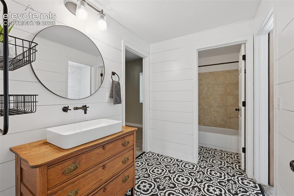 Image 44 of 49: Bedroom #5 with barn door to bath!