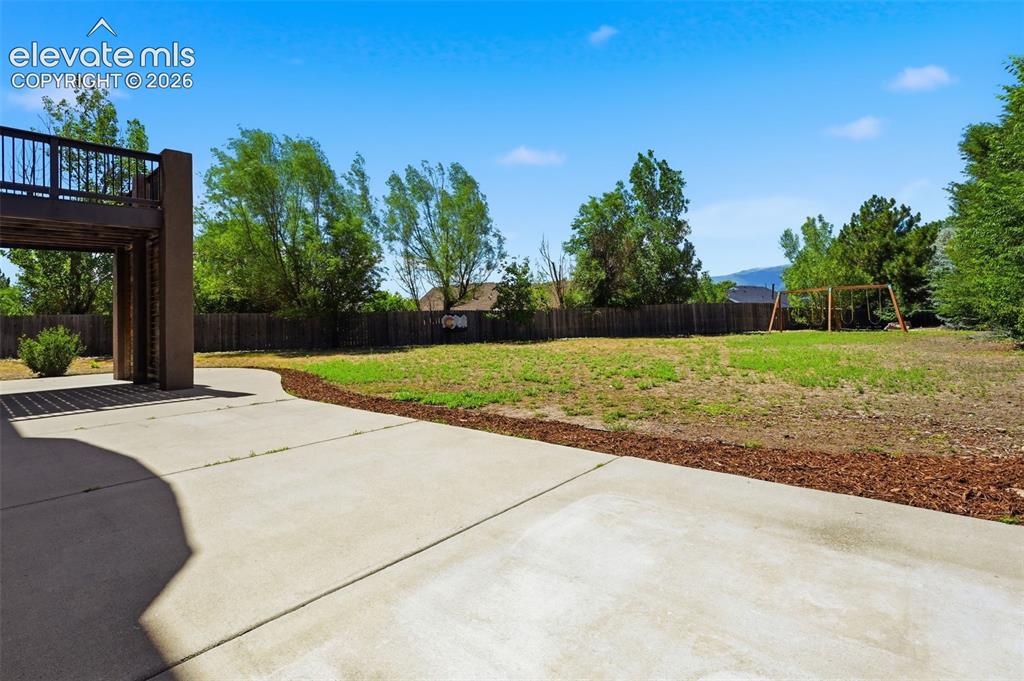 Image 47 of 49: Park like back yard with views, large patio, hot tub wiring and included sw