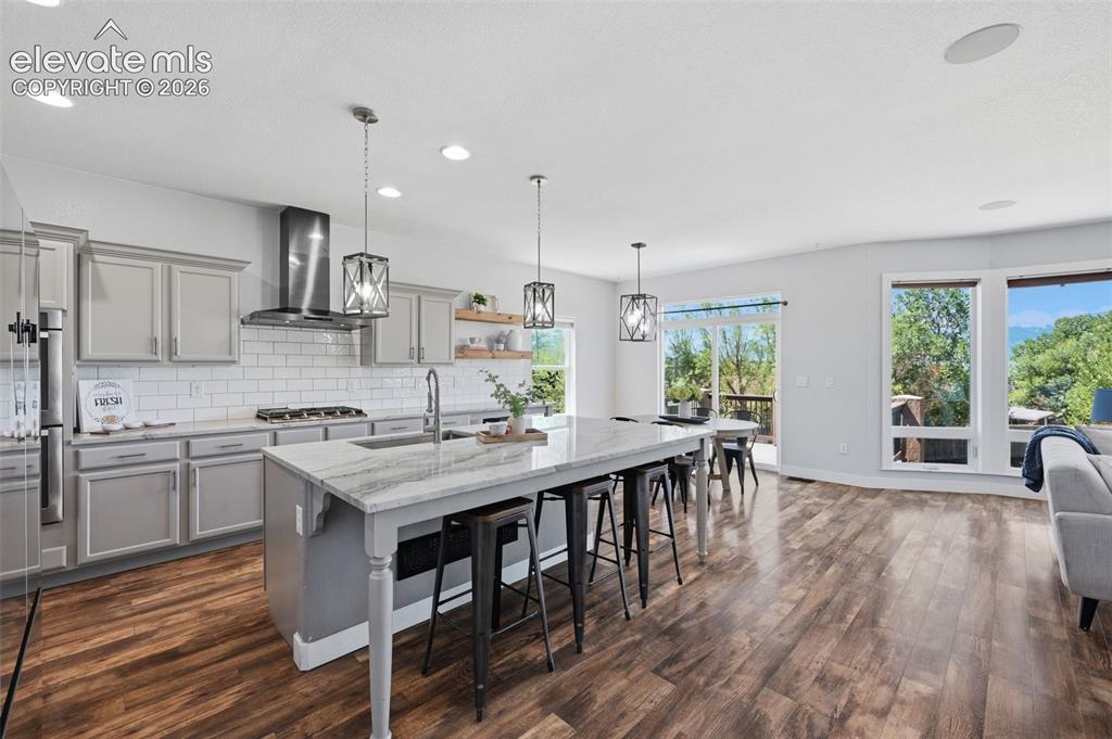 Image 5 of 49: Wow!  Views from every room!  Dolomite counters, open shelving, large islan