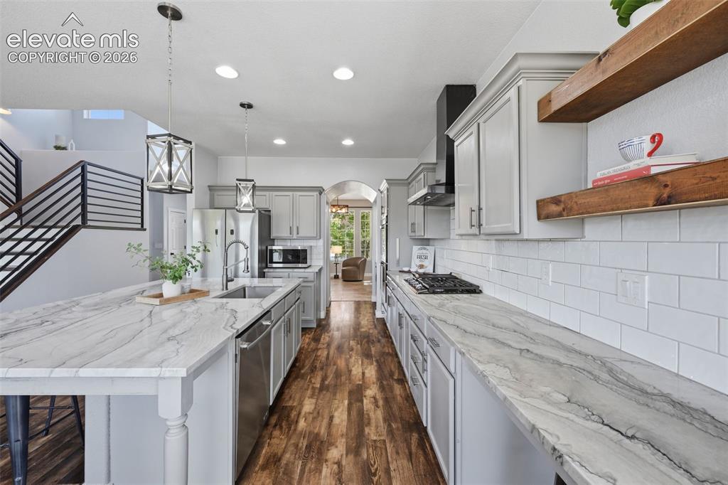 Image 7 of 49: Charming open shelves and upgraded appliances!