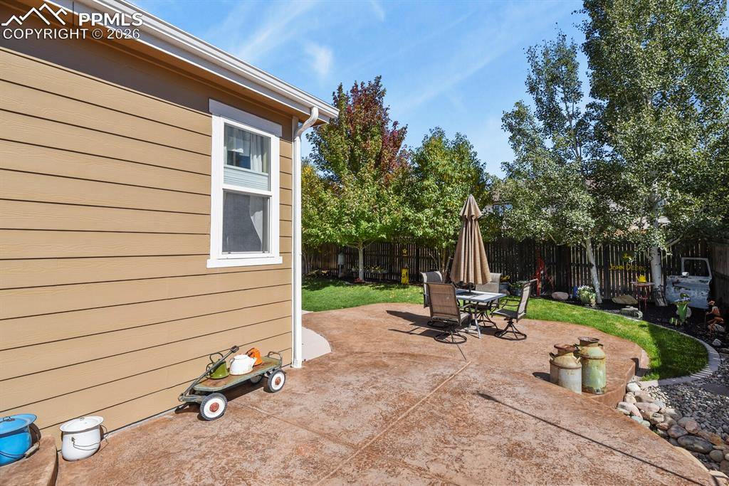 Image 14 of 43: Fully landscaped, extended patio.