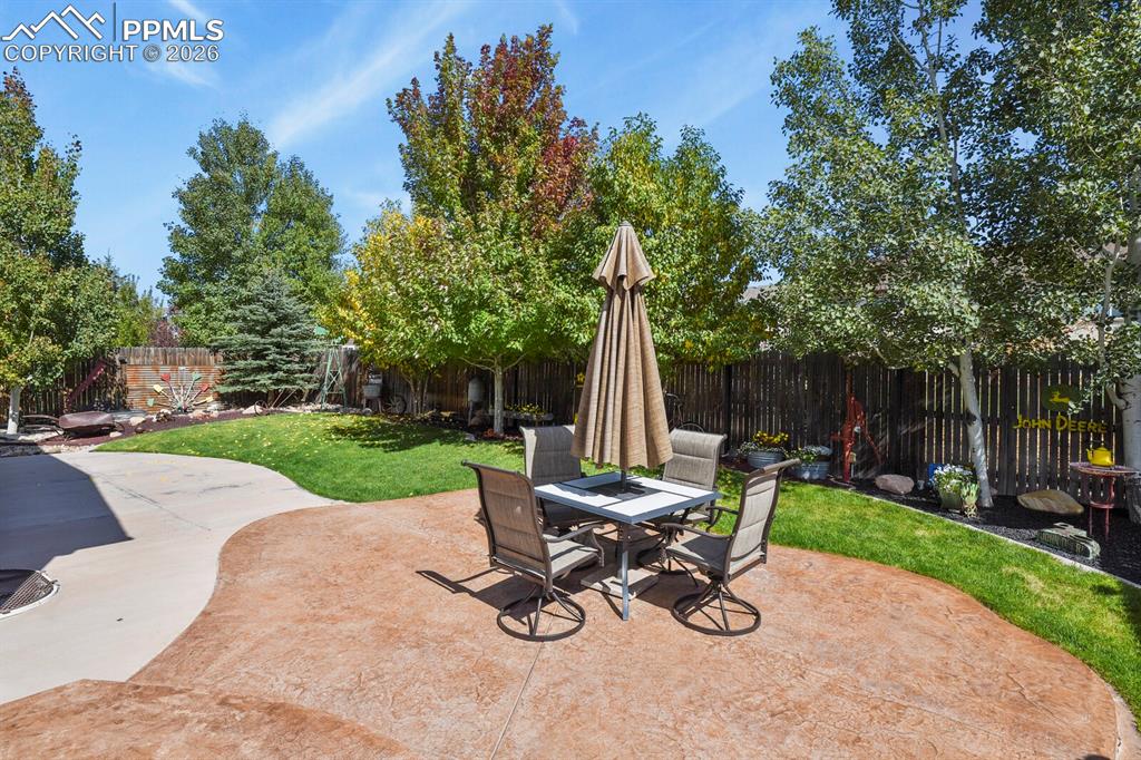 Image 15 of 43: Fully landscaped, extended patio.