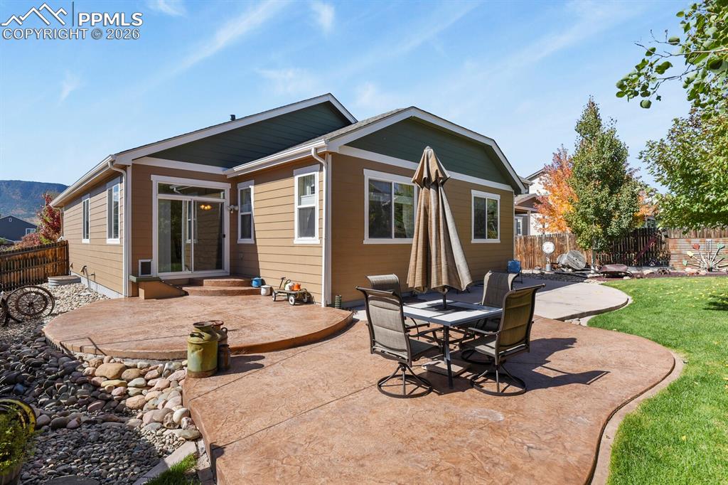 Image 2 of 43: Fenced backyard & Fully landscaped, auto sprinklers.