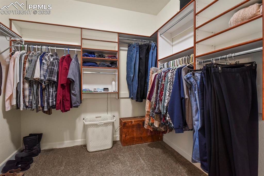 Image 21 of 43: Large Walk-in closet at Main Level Primary Bedroom