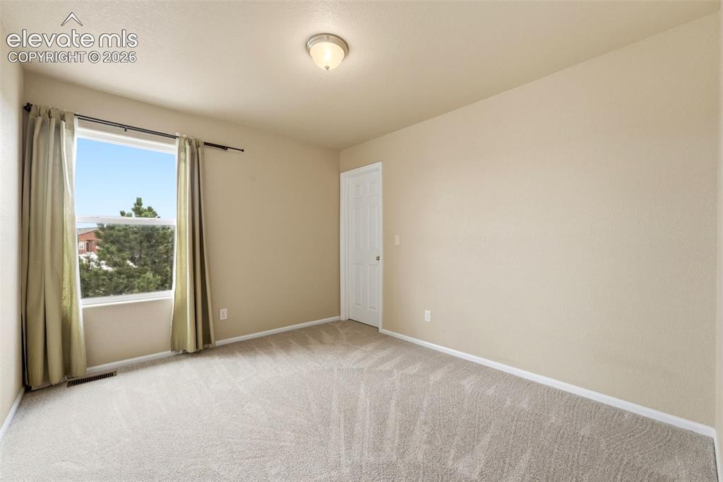 Image 13 of 33: Recessed window with exterior scenery, overhead lighting fixture, light-ton