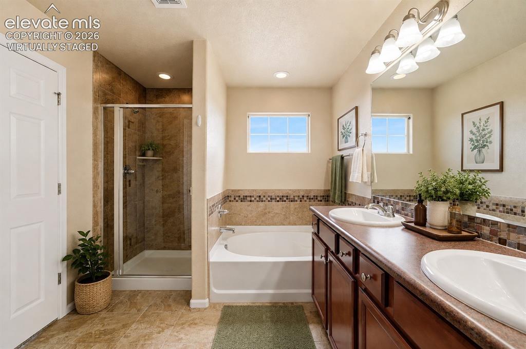 Image 19 of 33: *Virtually Staged*
Dual vanity with integrated sinks, full-width mirror, a