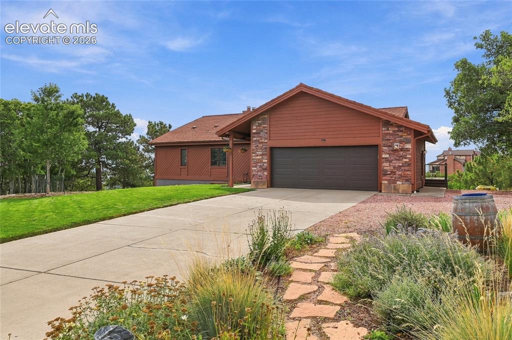 Caption: Front of home with flat front lawn