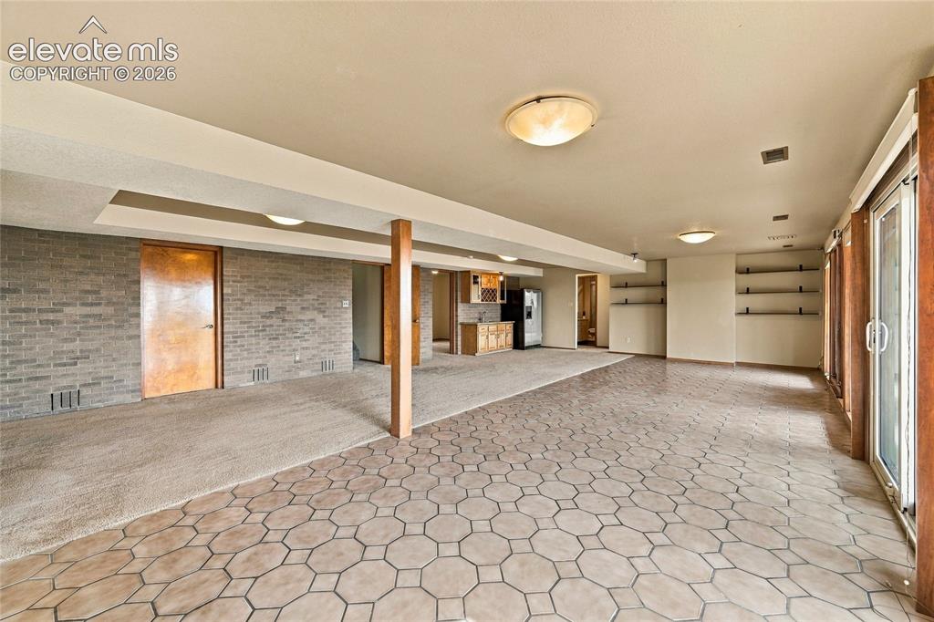 Image 30 of 50: enormous family room with lots of function