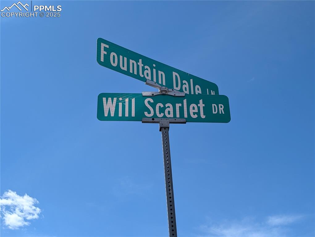 Image 11 of 12: Cross Street Sign