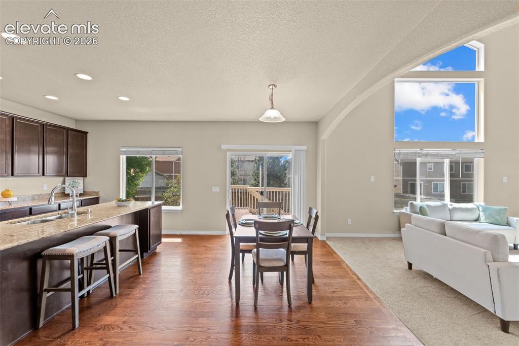 Image 17 of 44: breakfast dining off kitchen and living room
