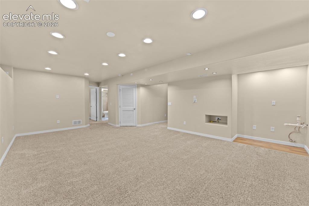 Image 30 of 44: oversized family room with wetbar preplumb