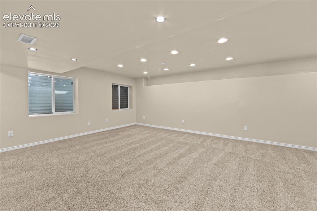 Image 31 of 44: oversize family room with game area