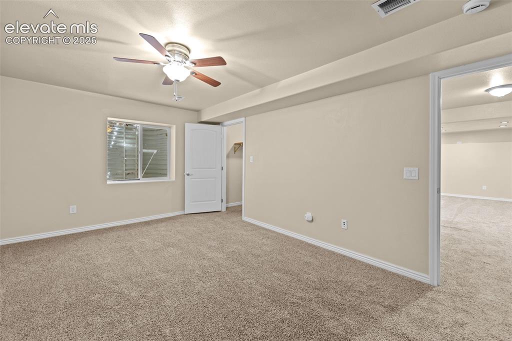Image 32 of 44: basement bedroom