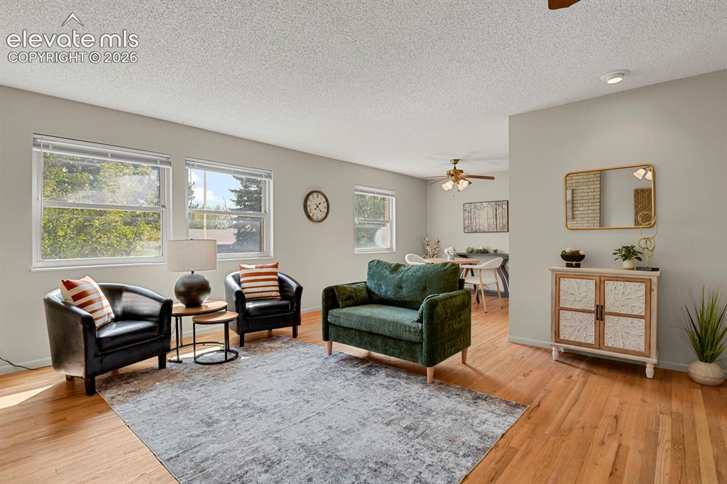 Image 10 of 48: Hardwood flooring, light gray wall color, recessed lighting, and multiple w
