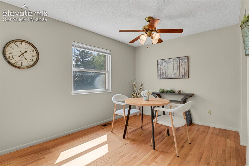 Image 13 of 48: Recessed single window, wood-finish flooring, ceiling fan with integrated l