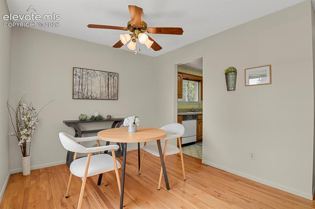 Image 14 of 48: Hardwood flooring, ceiling fan with integrated lighting, neutral wall palet