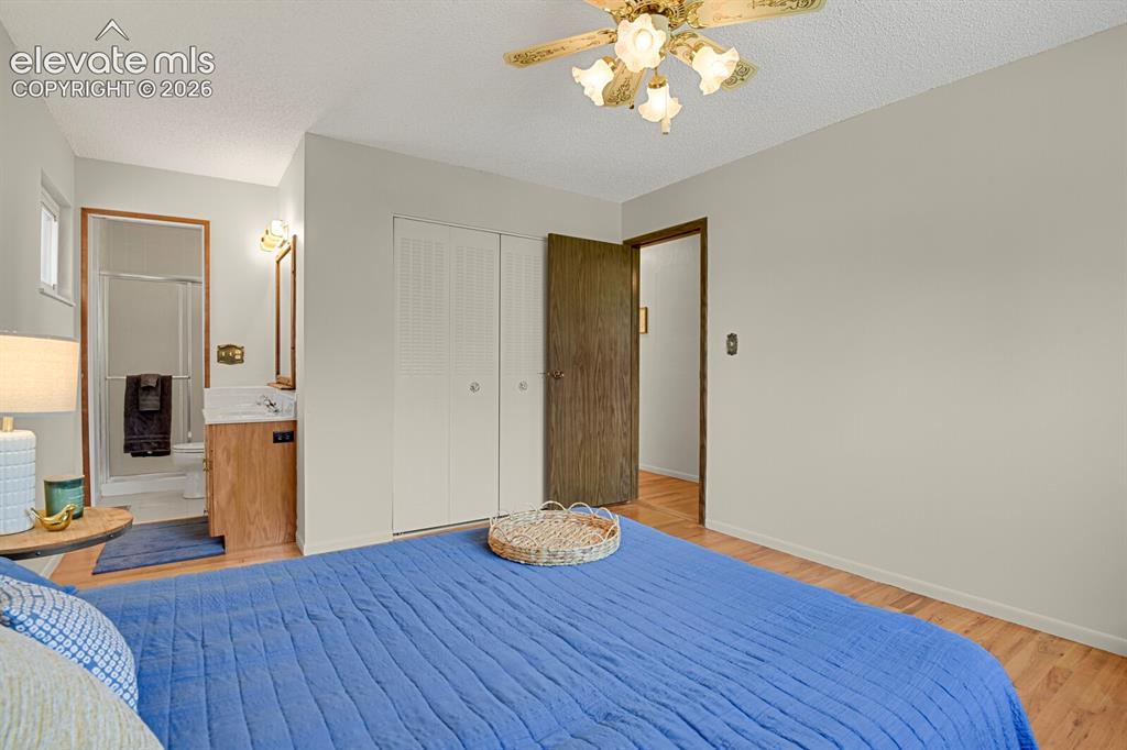 Image 23 of 48: Hardwood flooring with neutral wall tones