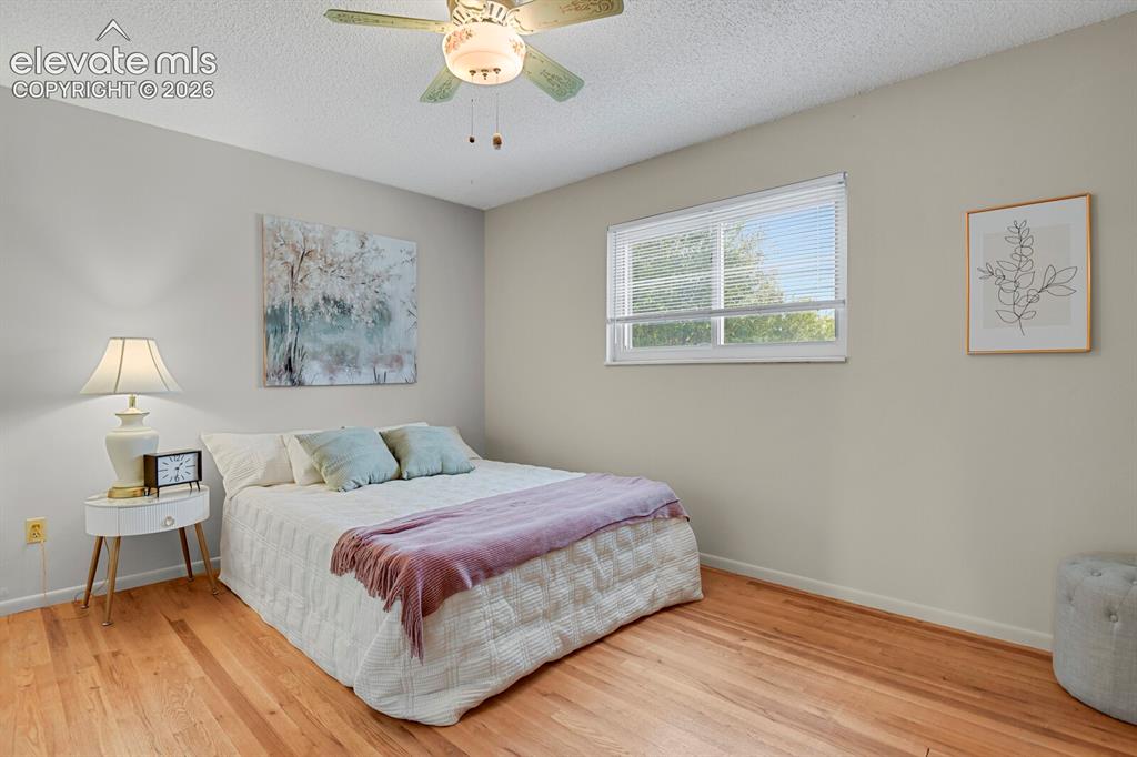 Image 25 of 48: Hardwood flooring, neutral wall paint, window with blinds