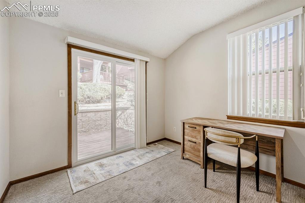 Image 7 of 34: Carpeted office space with baseboards