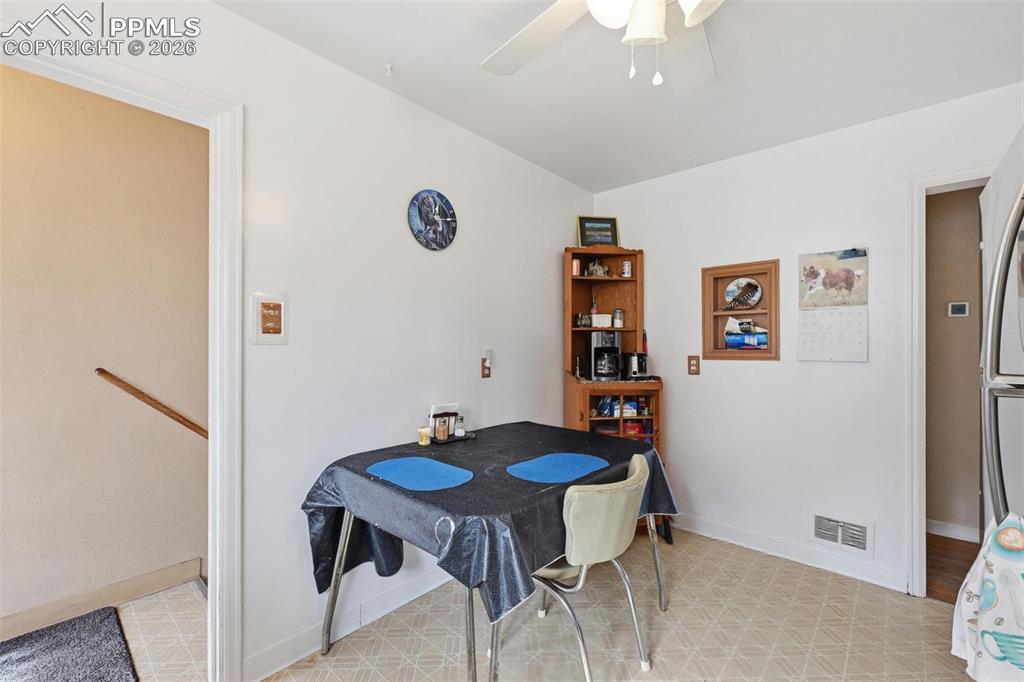 Image 13 of 23: Dining room featuring a ceiling fan and light flooring
