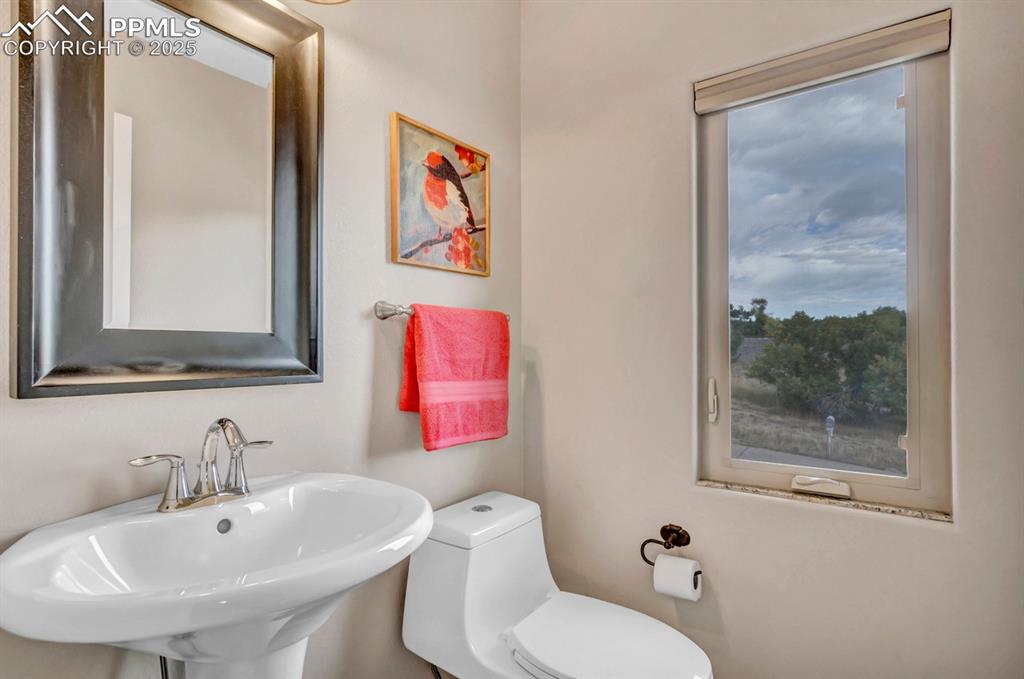 Image 13 of 41: Powder room up from the main level!