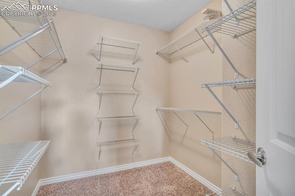 Image 16 of 41: Walk-in Closet in Primary