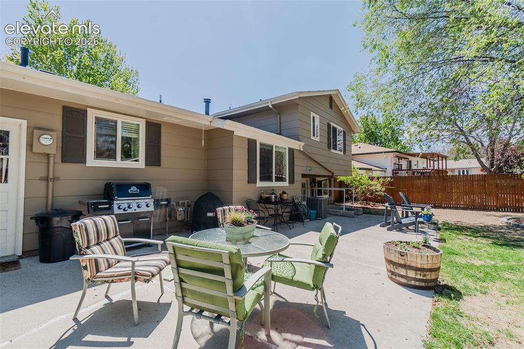 Image 14 of 30: Expansive concrete patio offering direct access to the home