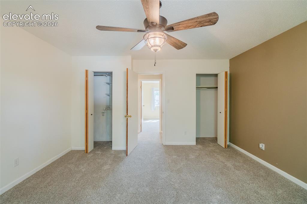 Image 26 of 42: Neutral tone walls and carpeting