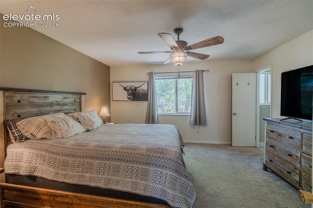 Image 9 of 30: Featuring neutral-toned walls, a window with exterior views, and a ceiling