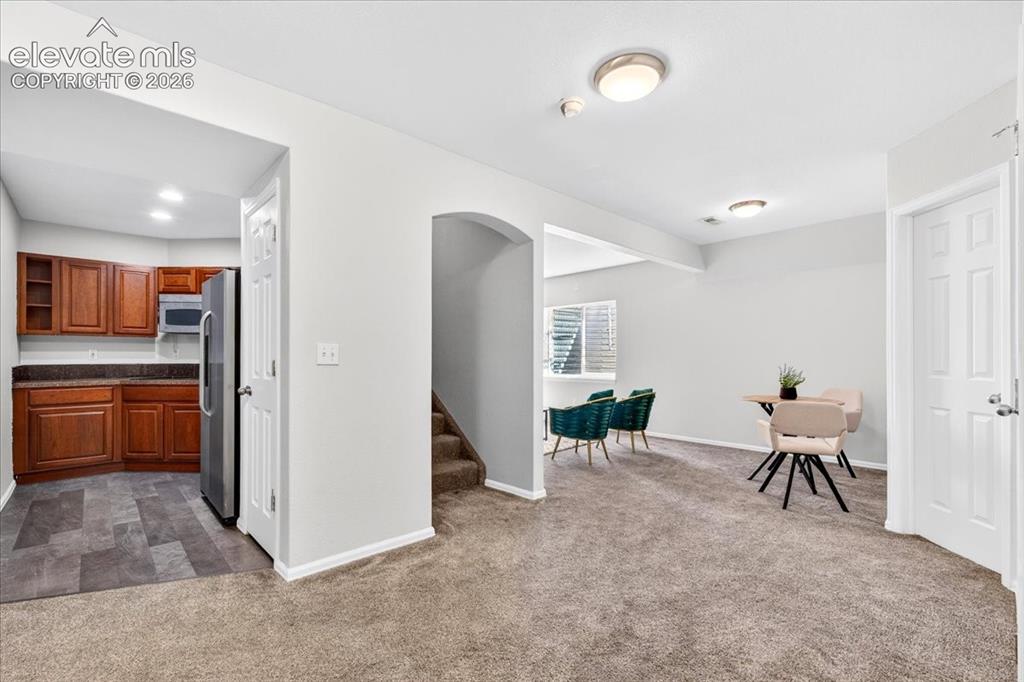 Image 23 of 34: Basement Kitchen and Open Space