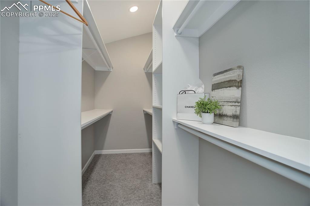 Image 19 of 31: Primary walk-in closet