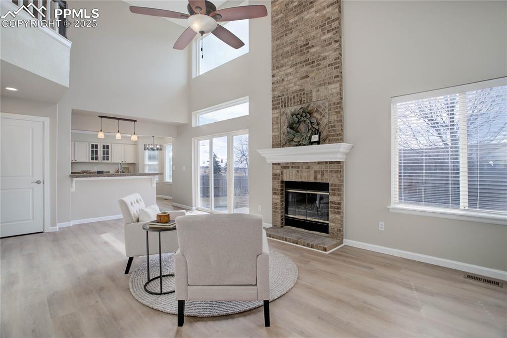 Image 9 of 31: 2-story ceiling & gas fireplace