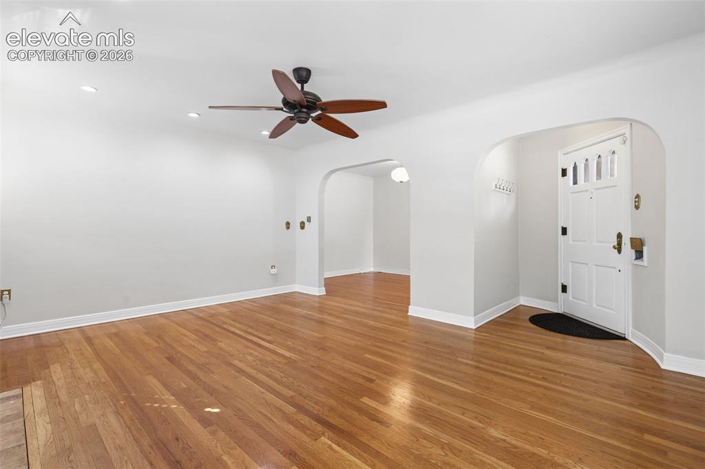 Image 12 of 50: Hardwood flooring throughout, overhead ceiling fan with lighting, recessed 