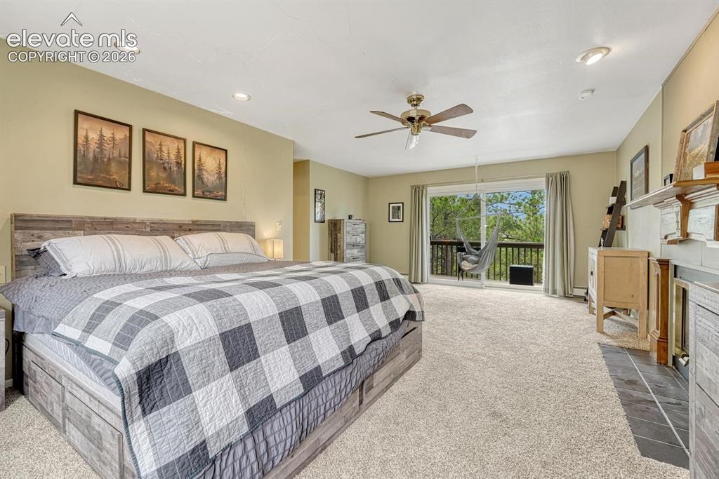 Image 30 of 48: Spacious carpeted room featuring a ceiling fan with light, recessed lightin
