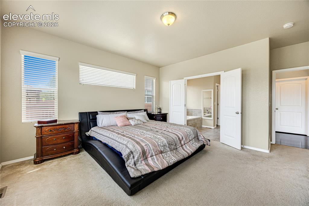 Image 13 of 43: Primary Bedroom