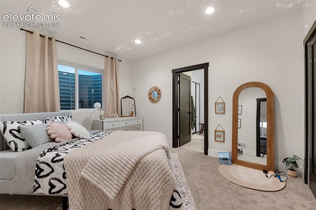 Image 22 of 29: Basement bedroom with private bath