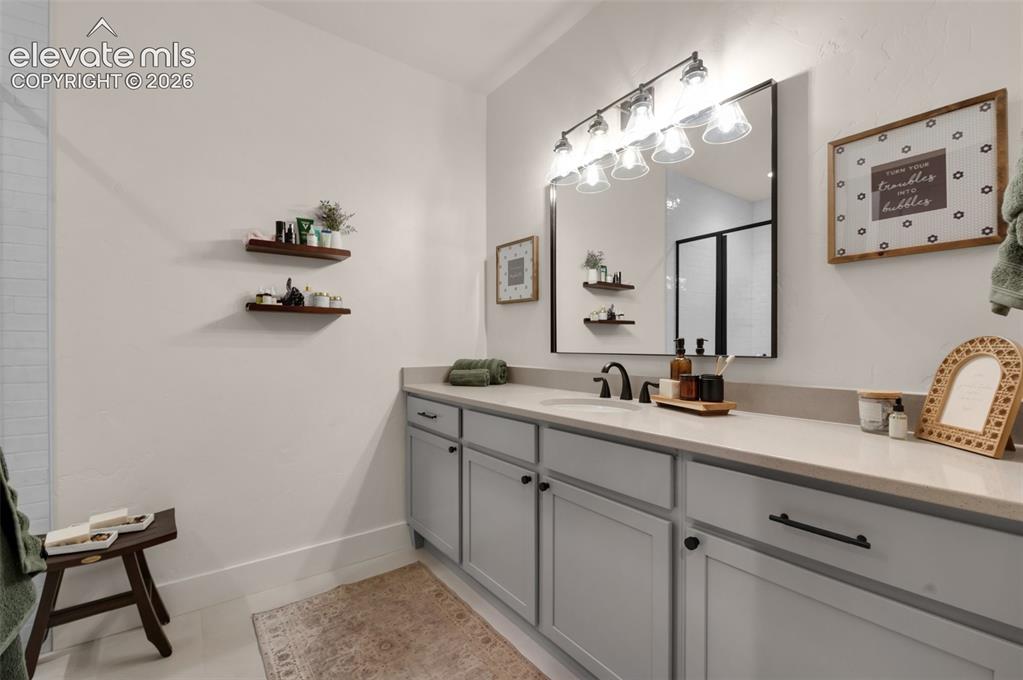 Image 23 of 29: Guest suite with private bath in basement
