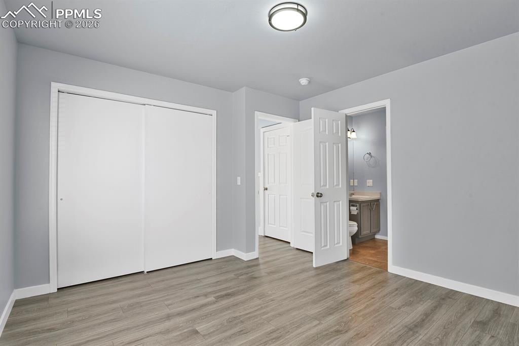 Image 15 of 38: 1 of 2 Primary Bedrooms - Main Level