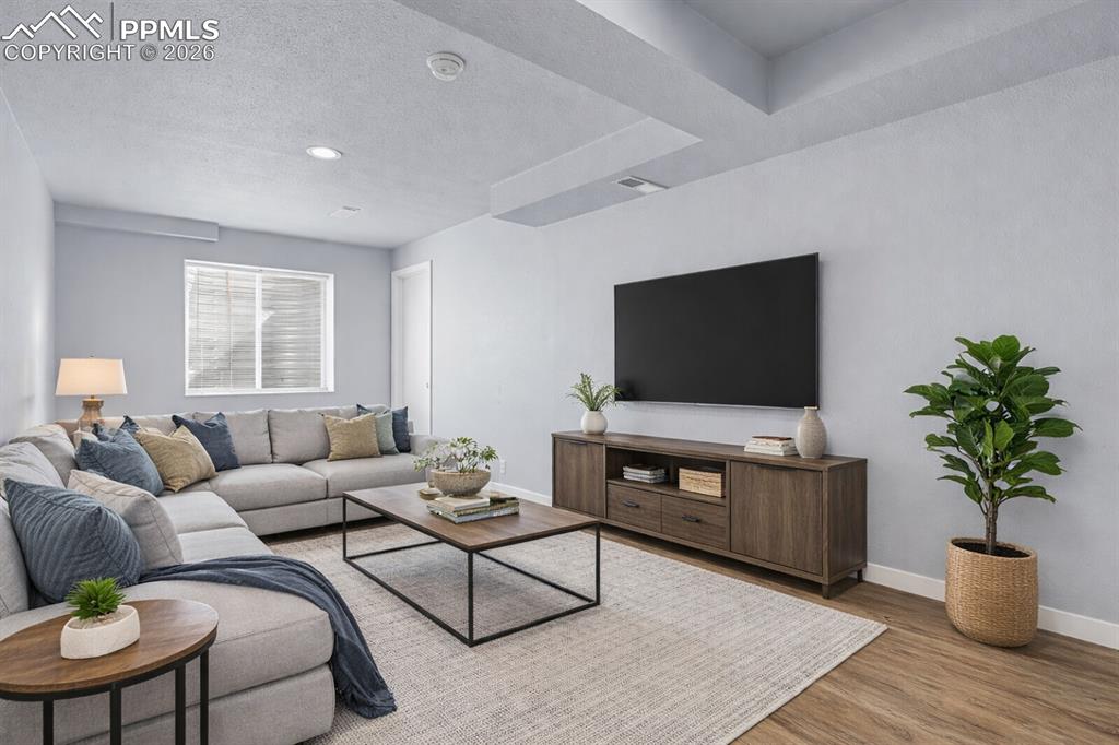 Image 28 of 38: Family Room - Basement - Virtually Stage