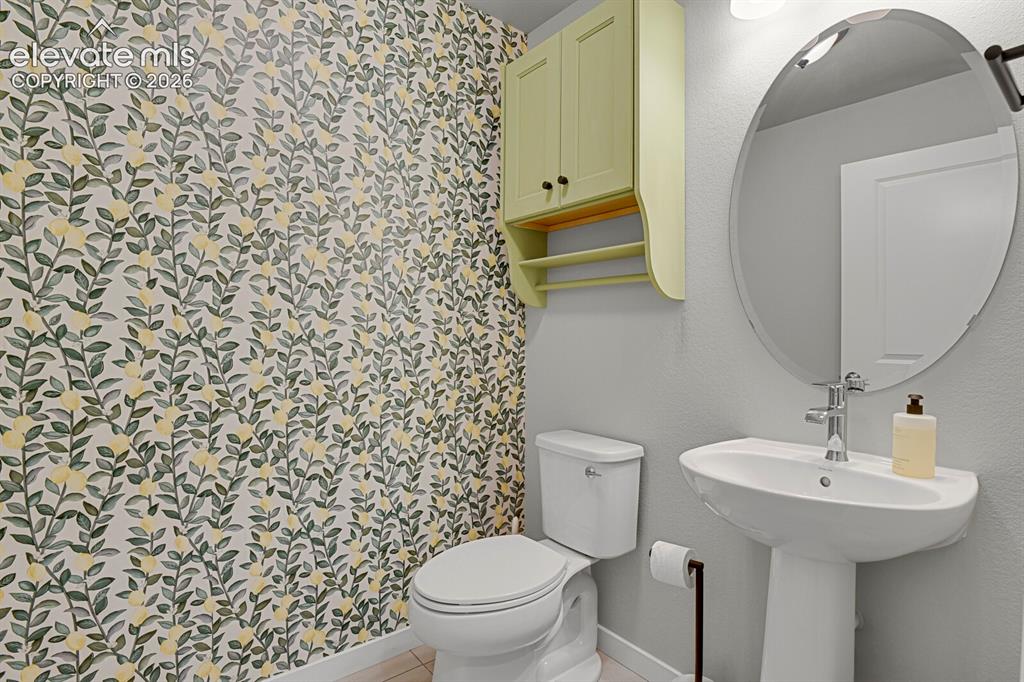 Image 14 of 26: main level half bath