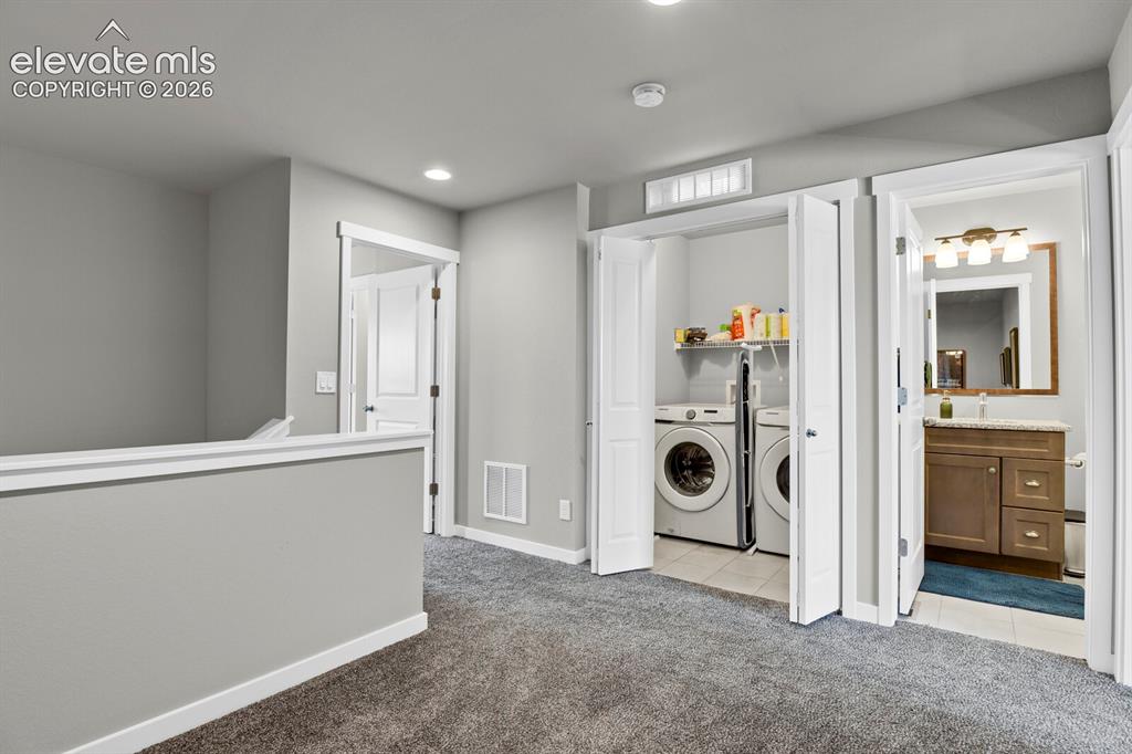 Image 16 of 26: Upper level laundry