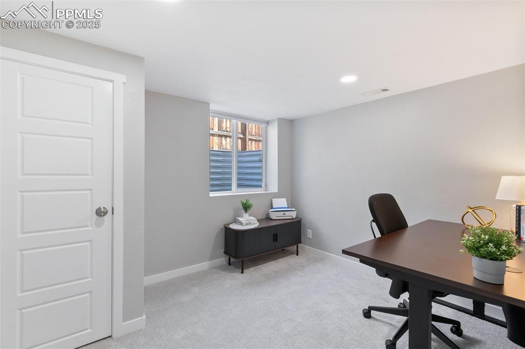 Image 28 of 39: Office featuring light colored carpet and recessed lighting