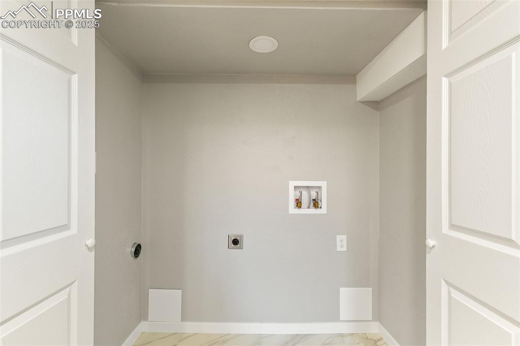 Image 31 of 39: Laundry area with hookup for an electric dryer, hookup for a washing machin