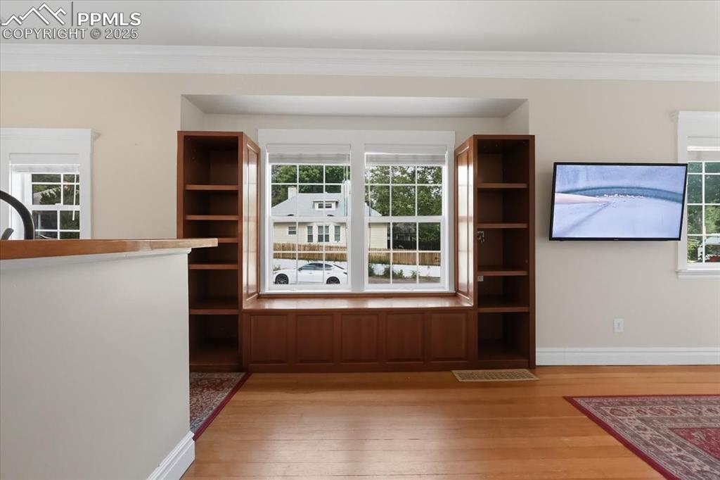 Image 10 of 48: Beautiful built-ins with window seating and storage.
